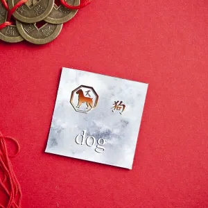 Dog zodiac card with Chinese character on a red background with coins