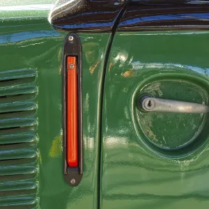 Detail of a Green Car's Door Handle and Lock Print