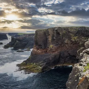 The dramatic cliffs under the Eshaness Lighthouse; Shetland islands The dramatic cliffs under the Eshaness Lighthouse; Shetland islands