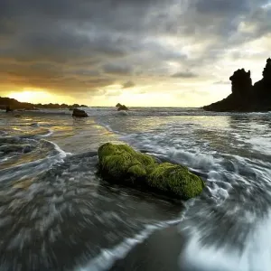 Dramatic cloud atmosphere with rock formation at sunset on the beach of Playa de Benijo Dramatic cloud atmosphere with rock formation at sunset on the beach of Playa de Benijo