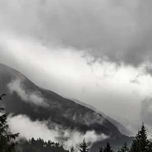 Dramatic mountain scenery with thick fog Dramatic mountain scenery with thick fog