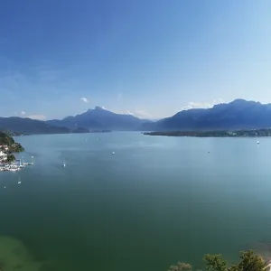 Drone shot, lakeside promenade with Schafberg and Drachenwand Drone shot, lakeside promenade with Schafberg and Drachenwand