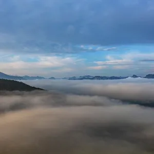 Drone shot, morning fog on Mondseeberg with Schafberg