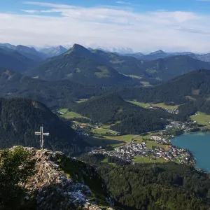 Drone shot, summit cross on the Frauenkopf with a view of Lake Fuschl Drone shot, summit cross on the Frauenkopf with a view of Lake Fuschl