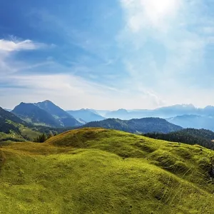 Drone shot, at the summit of the Taborberg with a view of the Osterhorn group and Dachstein massif