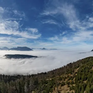 Drone shot, view from Schwarzenberg to a sea of fog in the Salzach valley