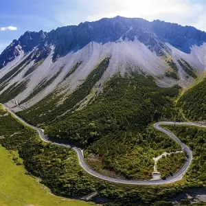 Drone shot, winding mountain road Drone shot, winding mountain road