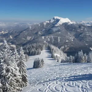 Drone shot, winter landscape with ski tracks in deep snow
