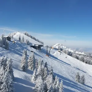 Drone shot, winter landscape with ski tracks in deep snow