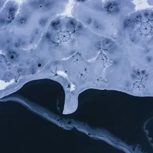 Drone view. Abstract forms created on surface of freezing lake Drone view. Abstract forms created on surface of freezing lake