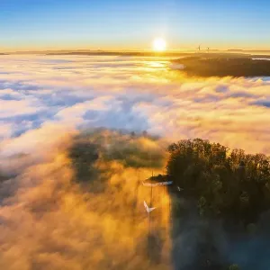 Drone view of sunrise with clouds over valley Remstal in autumn