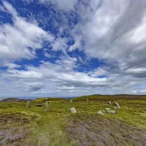 Druids Circle, stone circle in wide landscape with pastures in the mountains Druids Circle, stone circle in wide landscape with pastures in the mountains