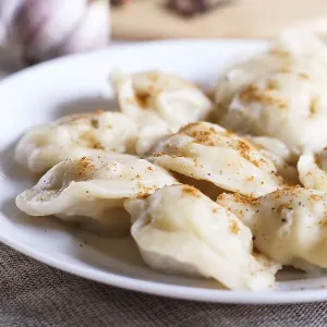 Dumplings on a white plate, selective focus Dumplings on a white plate, selective focus