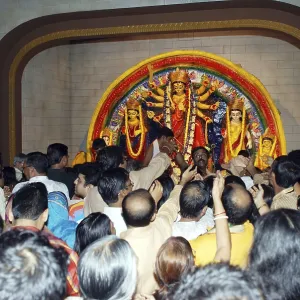 Durga clay model and devotes on Durga puja