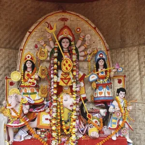 Durga clay model with statues of kartikeya ganesha and lakshmi saraswati on Durga puja