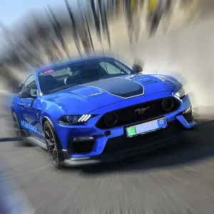 Dynamic photo with zoom effect of sports car race car Ford Mustang leaving pit lane