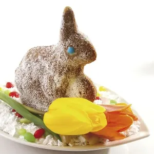 Easter bunny made of dough, sprinkled with icing sugar