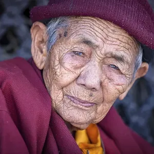 Elderly female Buddhist nun at Boudhanath stupa Elderly female Buddhist nun at Boudhanath stupa