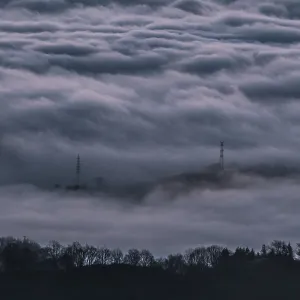 Electric poles between the mist of the mountains of the valley of Lesaka Electric poles between the mist of the mountains of the valley of Lesaka
