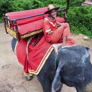 An elephant driver waiting for tourists at Angkor Wat Temple