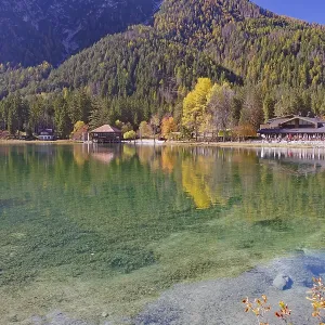 Emerald green, clear shore water with visible stones