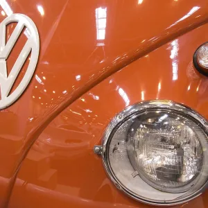 The front end of a Volkswagen bus with large VW logo