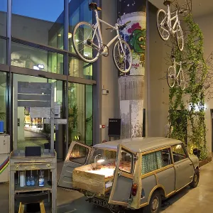 Entrance area to Monkey Bar with old Trabi in the evening Entrance area to Monkey Bar with old Trabi in the evening