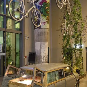 Entrance area to Monkey Bar with old Trabi in the evening Entrance area to Monkey Bar with old Trabi in the evening