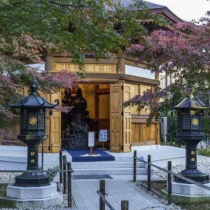 Entrance area of a traditional Japanese temple with autumn-colored foliage Entrance area of a traditional Japanese temple with autumn-colored foliage