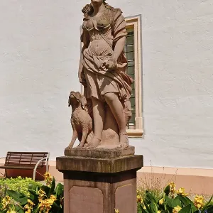 Ettlingen, Germany - August 2025: Sculpture of hunting goddess Diana in the castle garden of Ettlingen Ettlingen, Germany - August 2025: Sculpture of hunting goddess Diana in the castle garden of Ettlingen