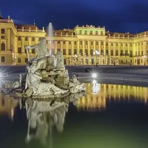 Evening atmosphere, Schoenbrunn Palace with reflection in the fountain