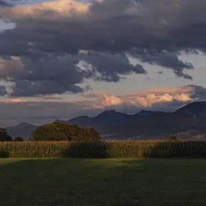 Evening landscape with mountains in the background Evening landscape with mountains in the background