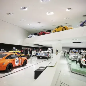Exhibition room with various Porsche cars