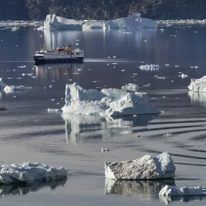 Expedition cruise ship between icebergs Expedition cruise ship between icebergs
