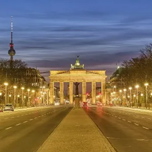 The famous Brandenburg Gate in Berlin with the TV tower at dusk