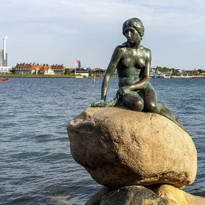 The famous bronze figure of The Little Mermaid - Den lille Havfrue - on the Langelinie waterfront promenade