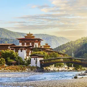 The famous Punakha Dzong with the wooden bridge The famous Punakha Dzong with the wooden bridge