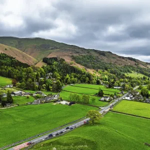 Farms and Mountains over road A591 from a drone