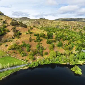 Farms and Mountains over road A591 from a drone