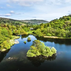 Farms and Mountains over road A591 from a drone