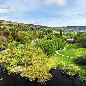 Farms and Mountains over road A591 from a drone