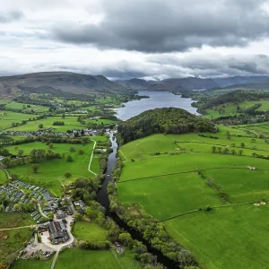 Farms and mountains over Ullswater Lake from drone