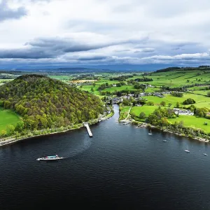 Farms and mountains over Ullswater Lake from drone