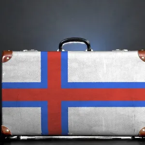 The Faroe Islands flag on a suitcase for travel The Faroe Islands flag on a suitcase for travel