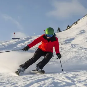 Female skier skiing in short turns