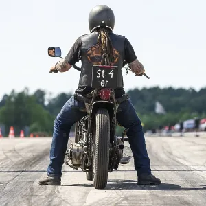 FINOWFURT, GERMANY - JUNE 28, 2024: The motorcycle racer on the racing line FINOWFURT, GERMANY - JUNE 28, 2024: The motorcycle racer on the racing line