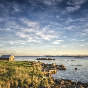 Fisherman's cabin on the fjord in the evening light Fisherman's cabin on the fjord in the evening light