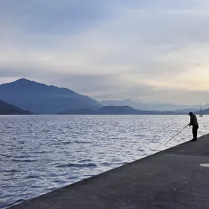 Two fishermen fishing in Lake Zug