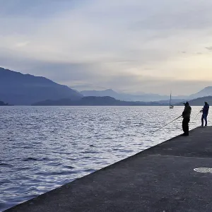 Two fishermen fishing in Lake Zug