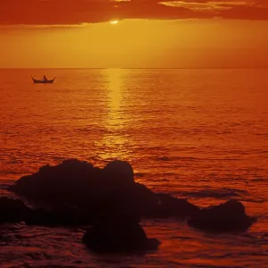 Fishing boats at sunset, silhouettes Fishing boats at sunset, silhouettes